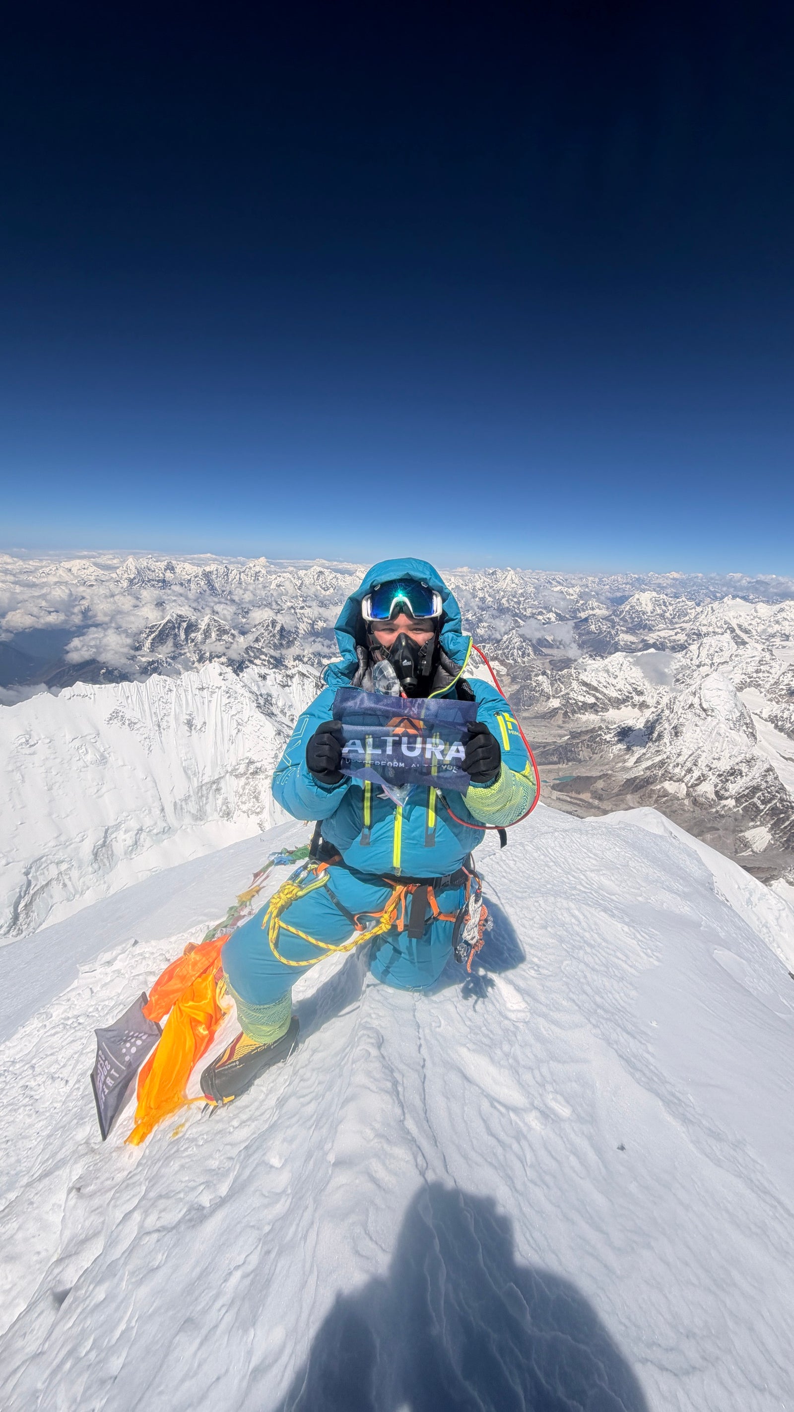 Tendi Sherpa on the summit of Everest with Altura flag